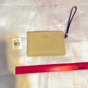 Coach wristlet cream color